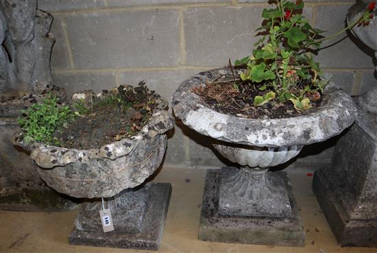 Two reconstituted stone urns on plinths, largest height 47cm, width 58cm